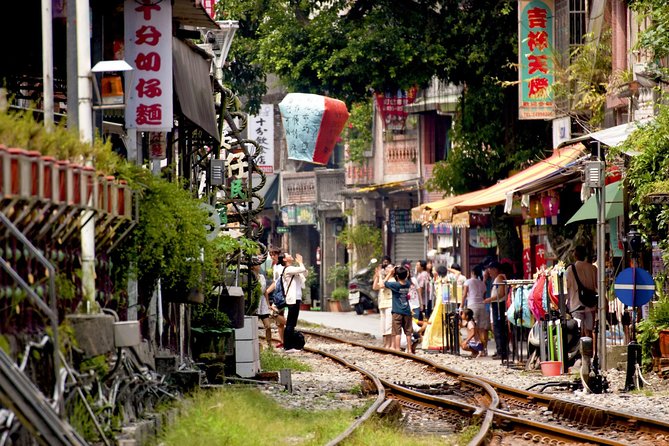 Private Jiufen & Pingxi Day Tour with English-Speaking Guide - Shifen Waterfall: the day’s strongest nature stop